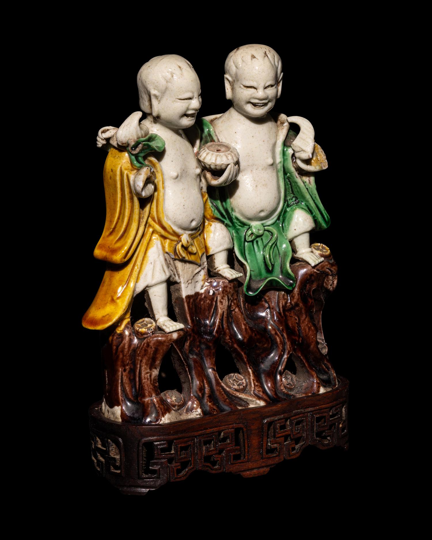 A Chinese Sanca i Glazed Porcelain Figural Group