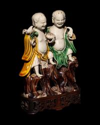 A Chinese Sanca i Glazed Porcelain Figural Group