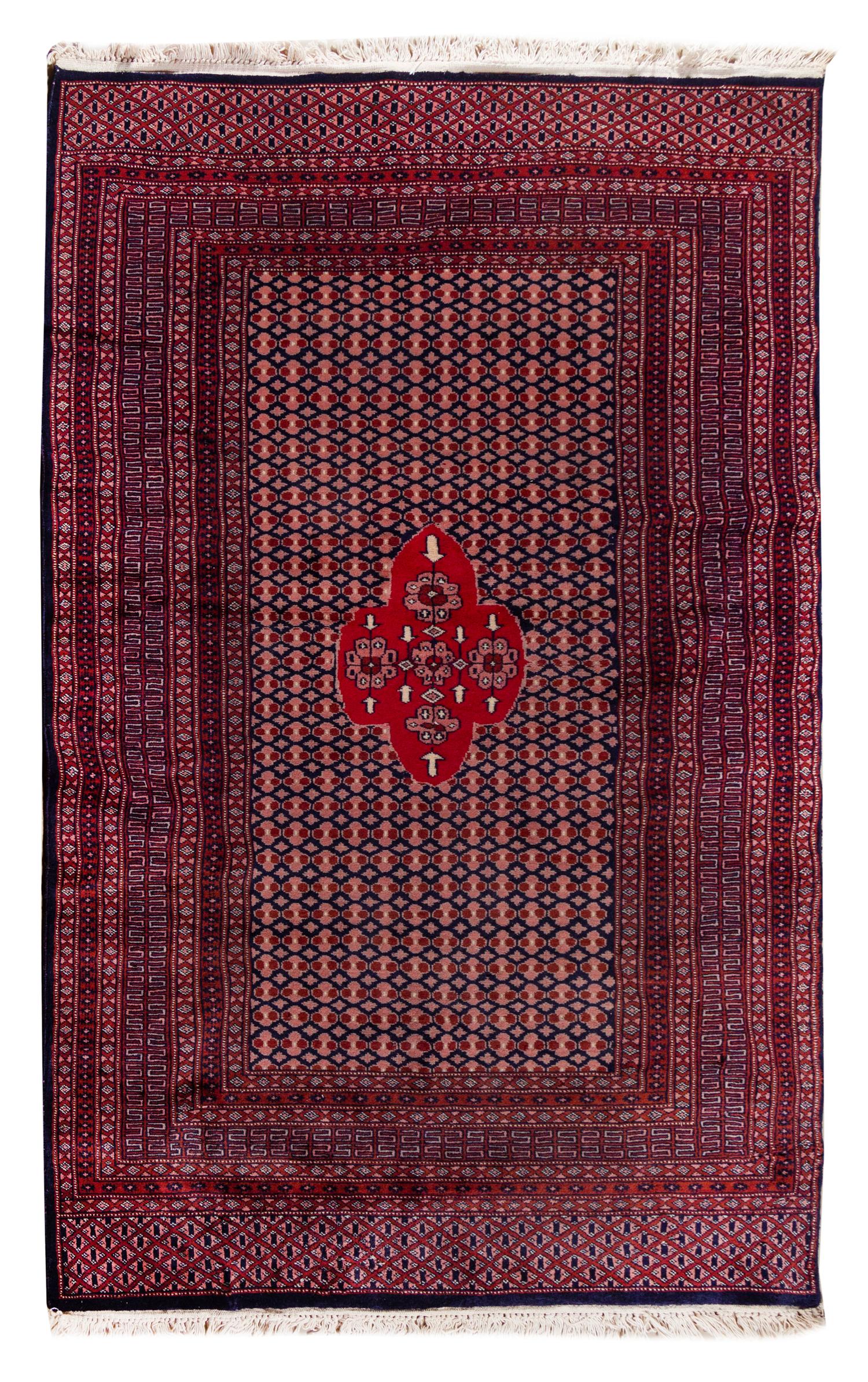 A Pakistani Wool Rug 6 feet 1 1/2 inches x 4 feet 2 inches. — 20TH CENTURY
