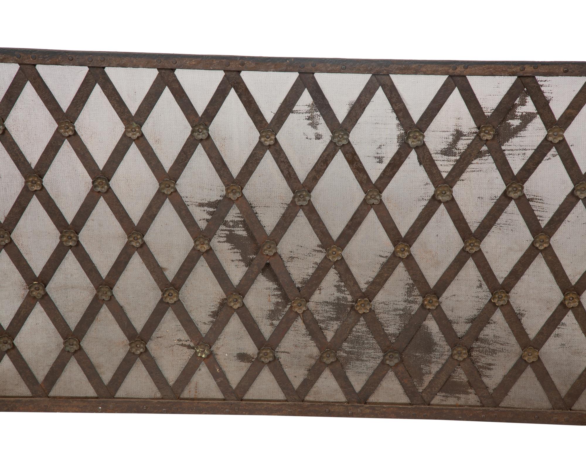 A Continental Neoclassical Style Parcel Gilt Iron Fire Screen