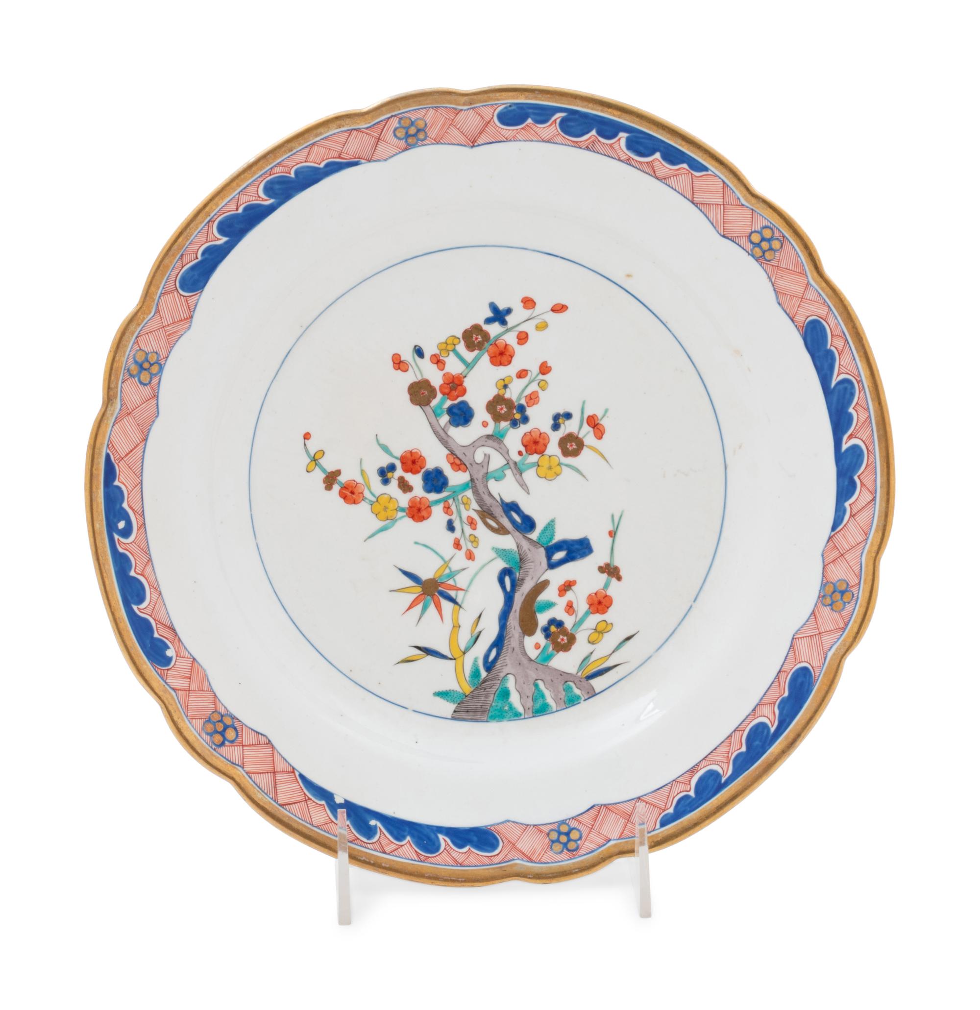 A Set of Twelve Spode Painted and Parcel Gilt Porcelain Dinner Plates