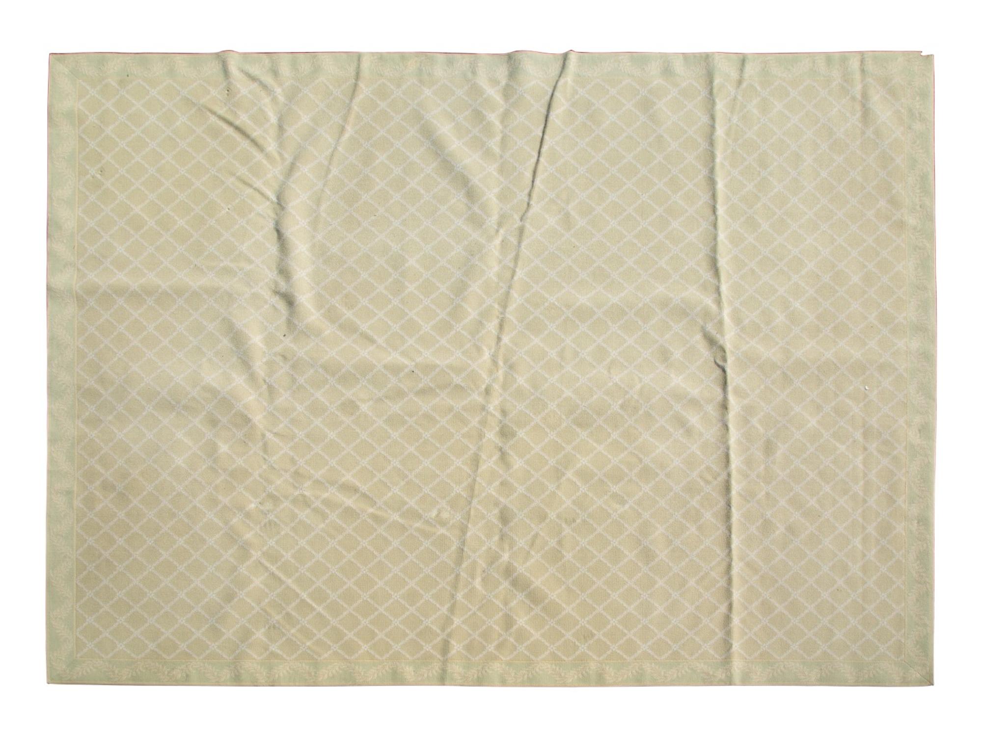 A Green and White Trellis Design Rug by Stark — 20TH CENTURY