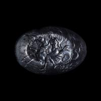 A Roman Smokey Quartz Intaglio with a Nereid Riding Two Hippocamps