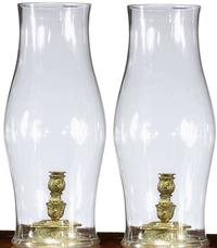 Pair of Continental brass candlesticks with blown glass hurricane shades 18th/19th century