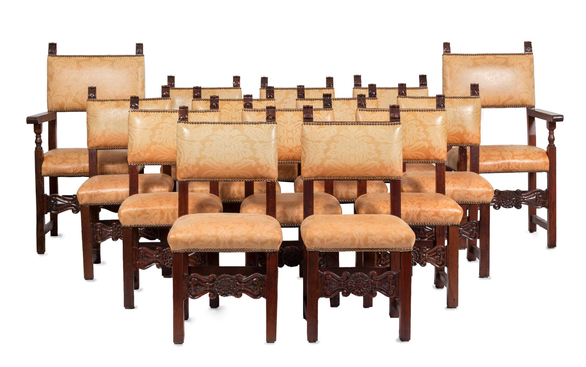 A Set of Fourteen Spanish Baroque Style Walnut Dining Chairs Height of armchair 46 1/4 inches.