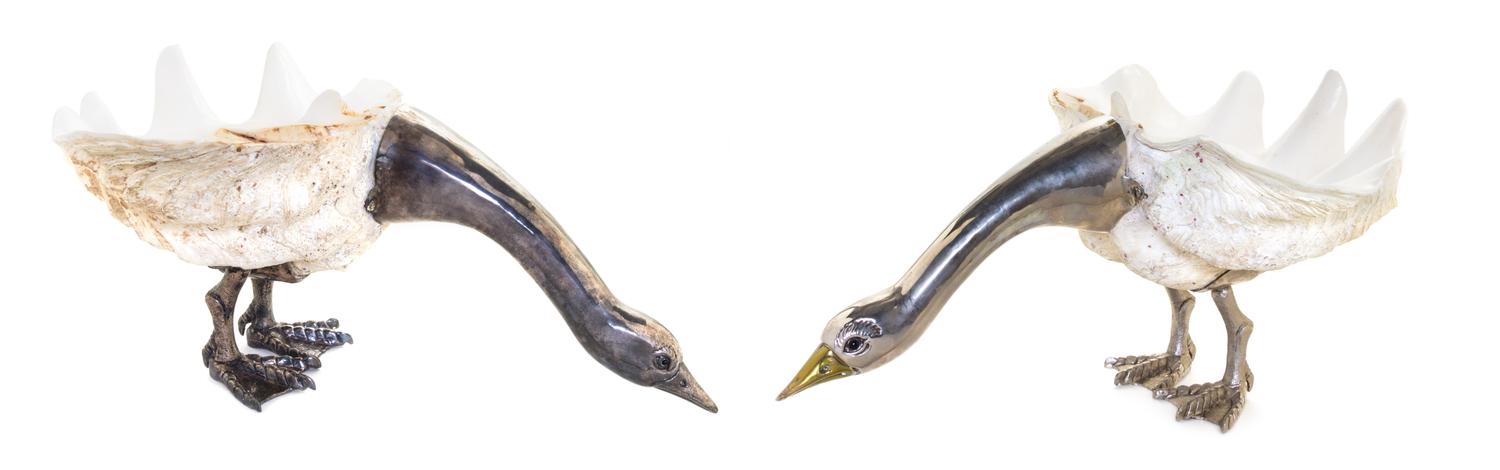 A Pair of Italian Silver Mounted Clam Shell Sculptures, Florence, 20th Century, formed as cormorants with their heads lowered.
