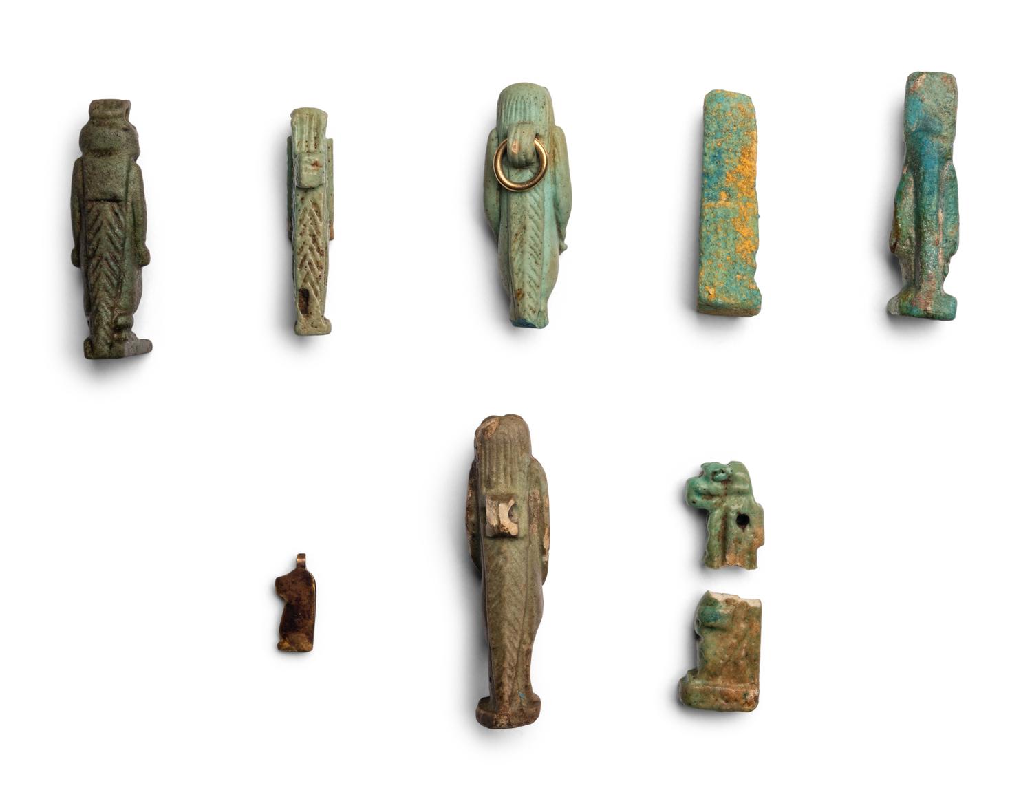 Eight Egyptian Faience and Gold Taweret Amulets