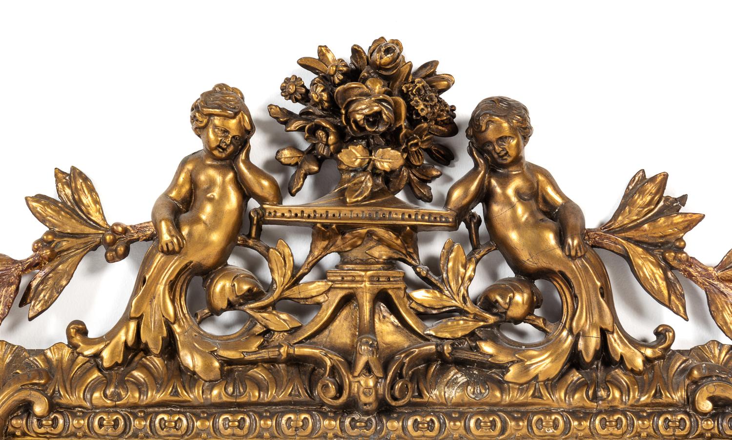 An Italian Baroque Giltwood Mirror