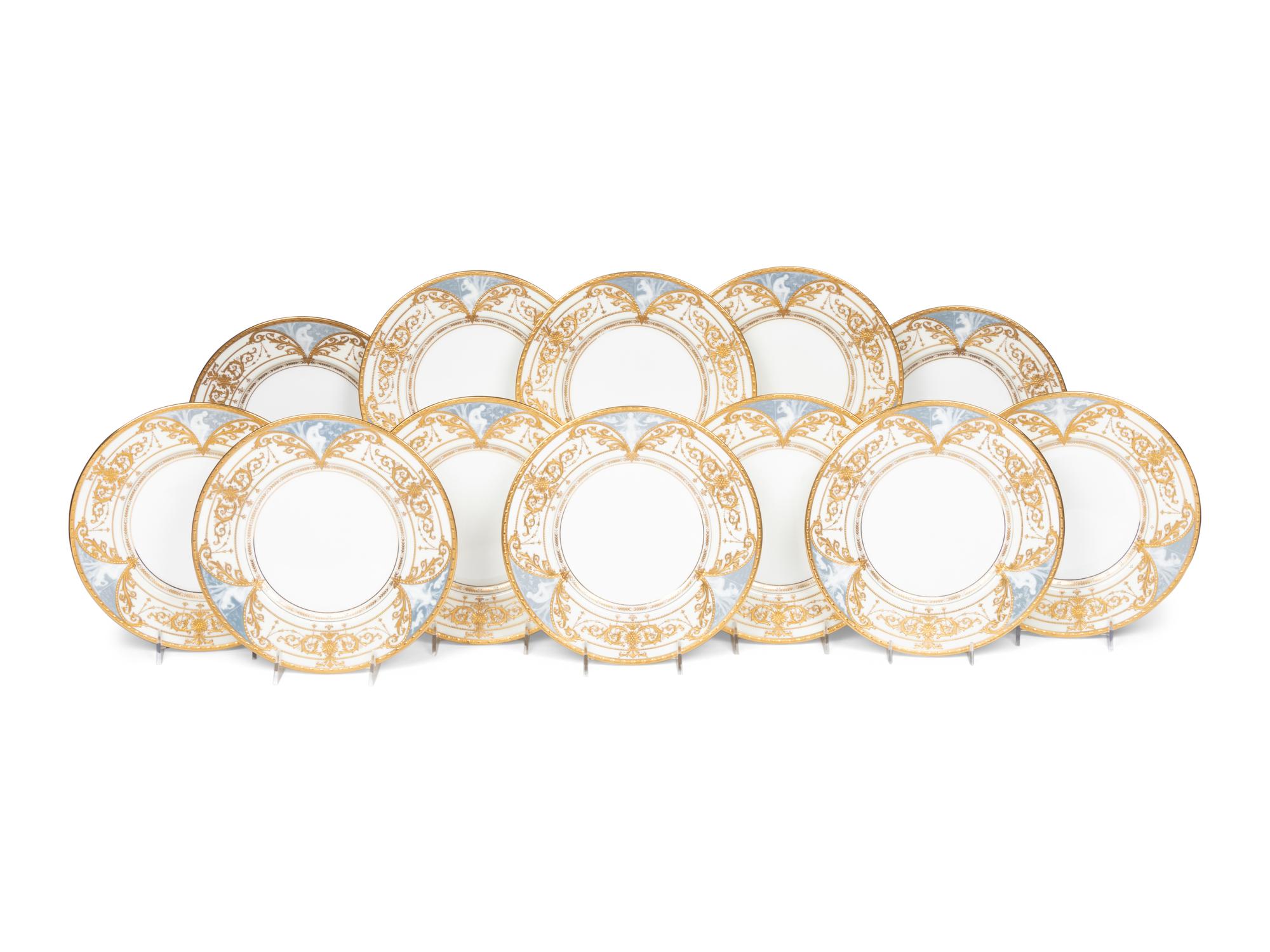 A Set of Twelve Mintons Pâte-sur-Pâte Parcel-Gilt Porcelain Plates
