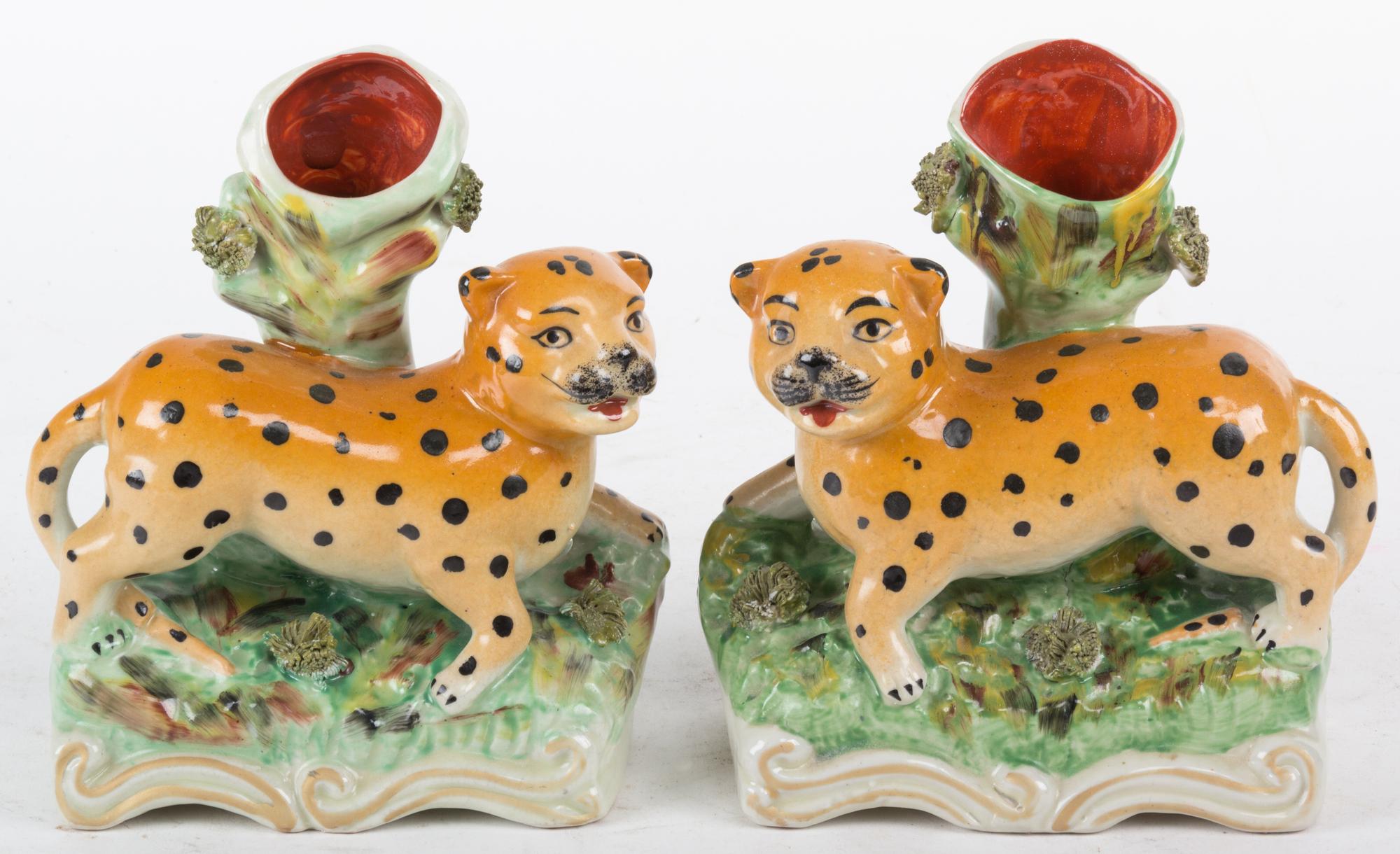 A Pair of Ceramic Bud Vases with Leopard Mounted Base Height 7 inches.