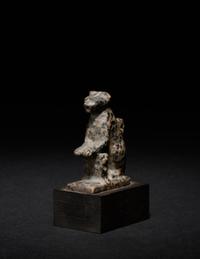 An Egyptian Granite Amulet of a Cat with Kittens