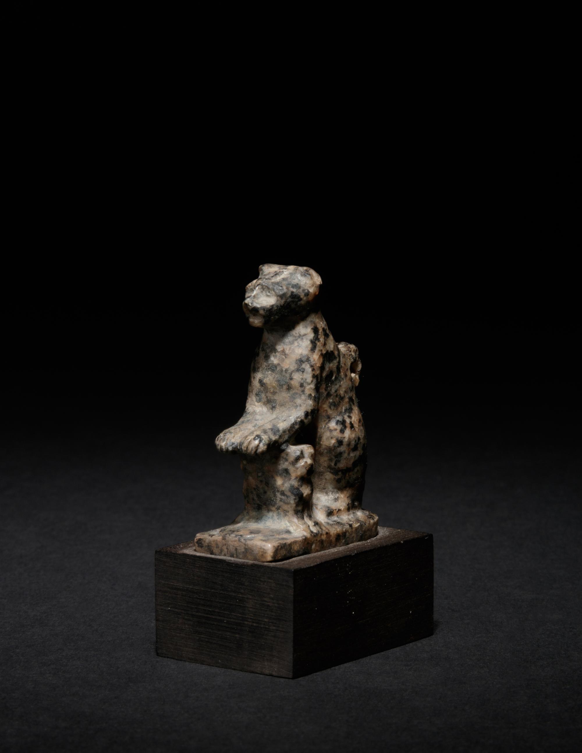 An Egyptian Granite Amulet of a Cat with Kittens