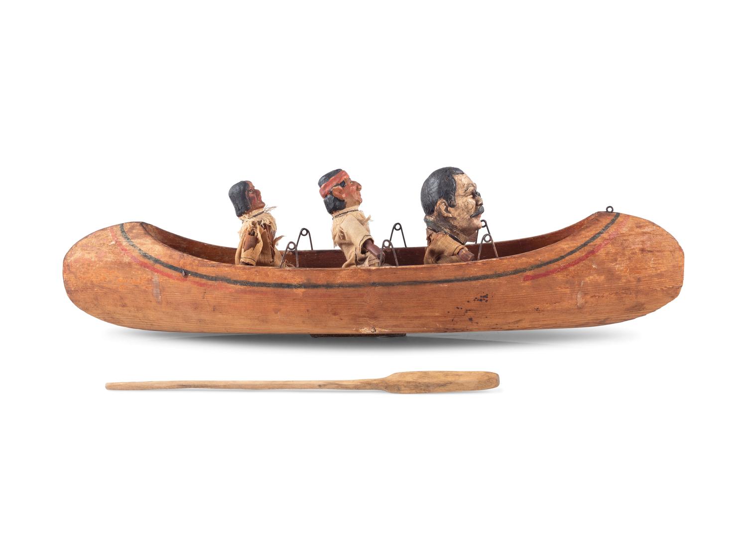 [ROOSEVELT, Theodore (1858-1919)]. Folk art canoe and figures representing Theodore Roosevelt's exploration of the River of Doubt during his expedition to Brazil in 1913-1914.