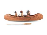 [ROOSEVELT, Theodore (1858-1919)]. Folk art canoe and figures representing Theodore Roosevelt's exploration of the River of Doubt during his expedition to Brazil in 1913-1914.