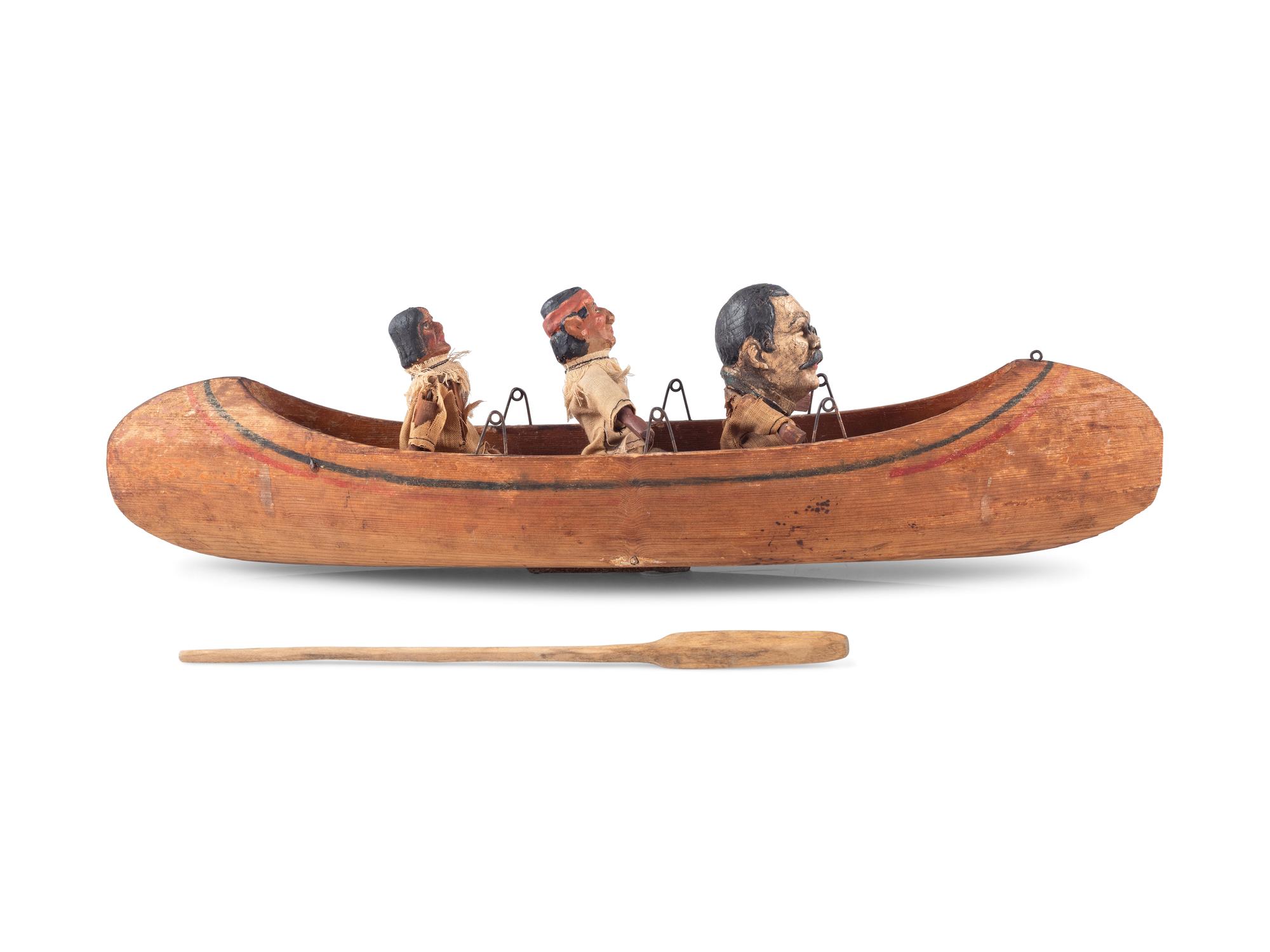 [ROOSEVELT, Theodore (1858-1919)]. Folk art canoe and figures representing Theodore Roosevelt's exploration of the River of Doubt during his expedition to Brazil in 1913-1914.