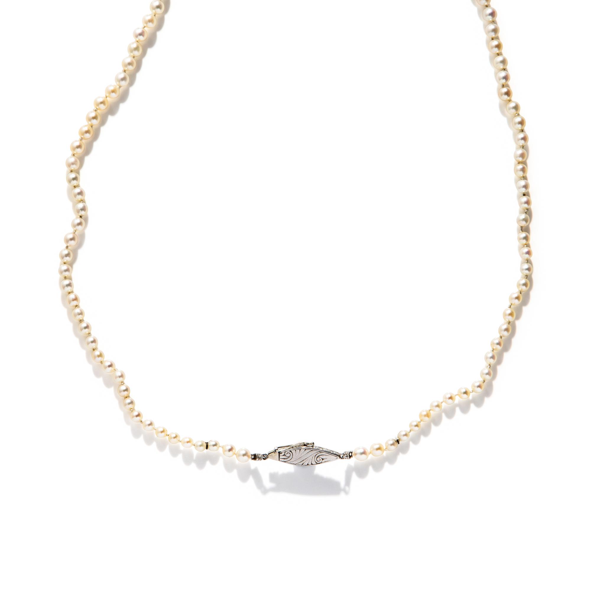 CULTURED PEARL STRAND WITH PLATINUM AND DIAMOND CLASP