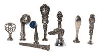 A Collection of Silver and Silvered Metal Seals, Height of tallest 4 1/2 inches.