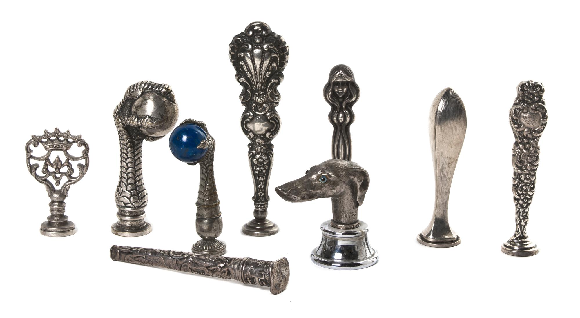 A Collection of Silver and Silvered Metal Seals, Height of tallest 4 1/2 inches.