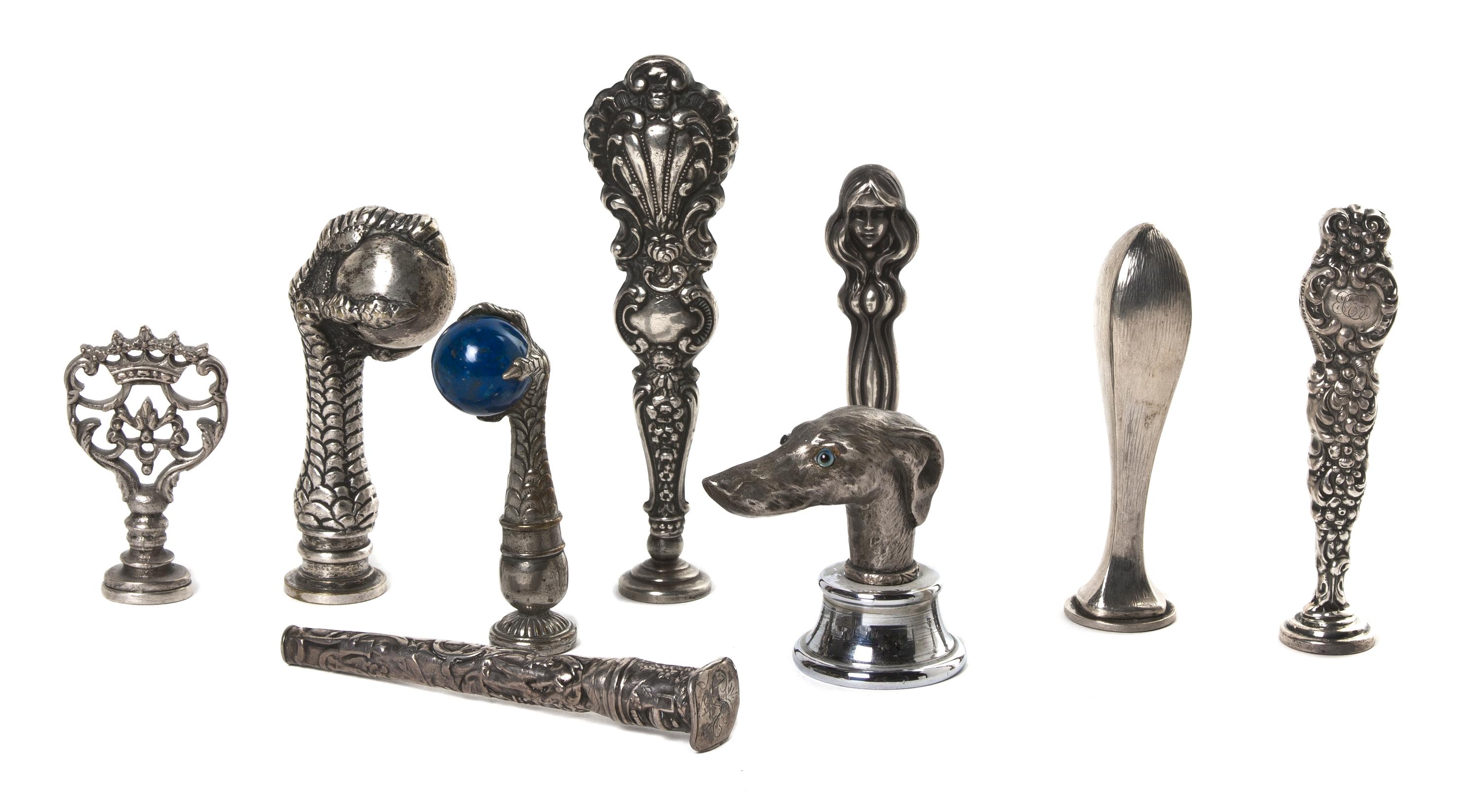 A Collection of Silver and Silvered Metal Seals, Height of tallest 4 1/2 inches.