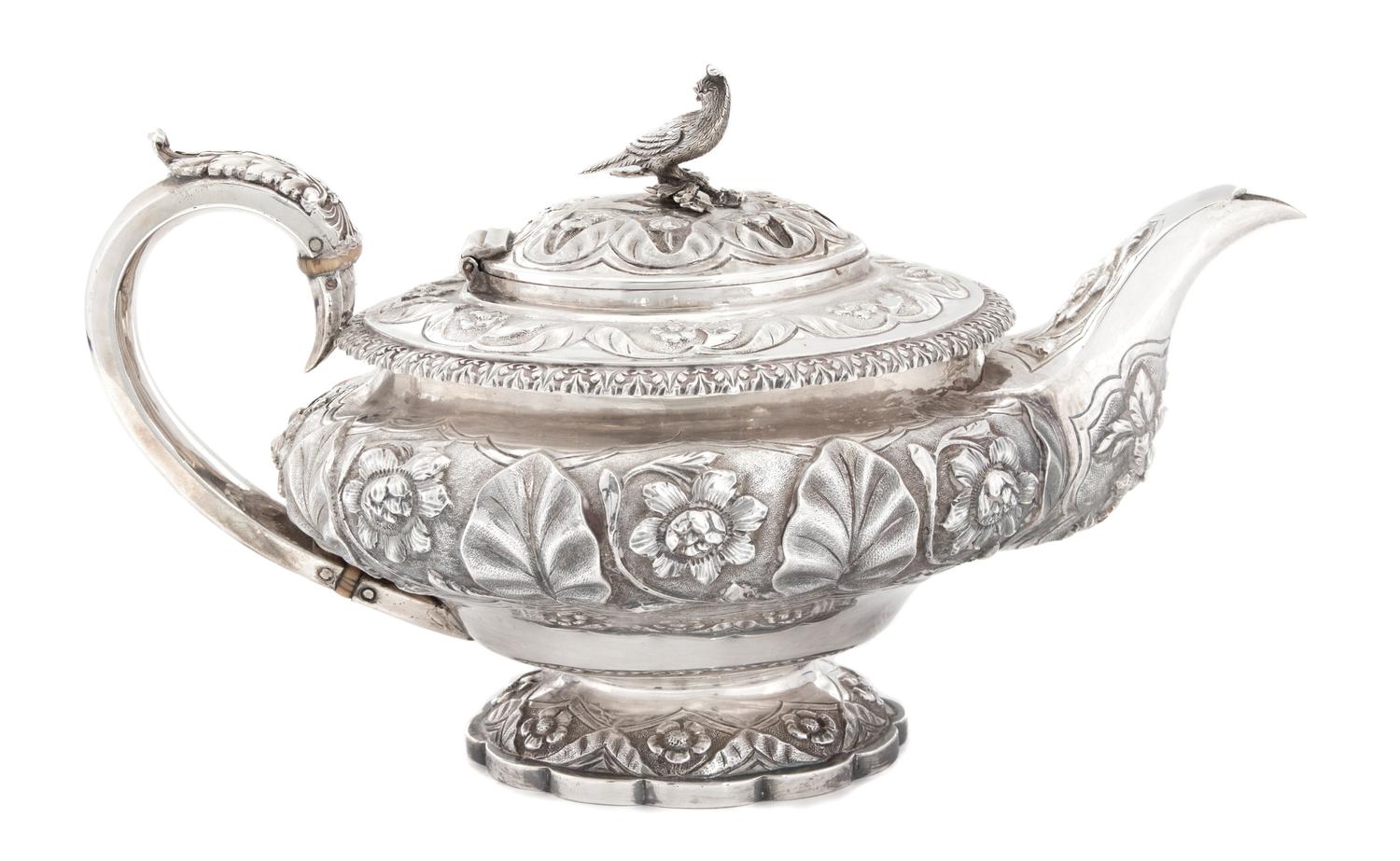An English Silver Teapot, Richard Pierce & George Burrows II, London, 1829, having repousse decoration and a pheasant form finial.