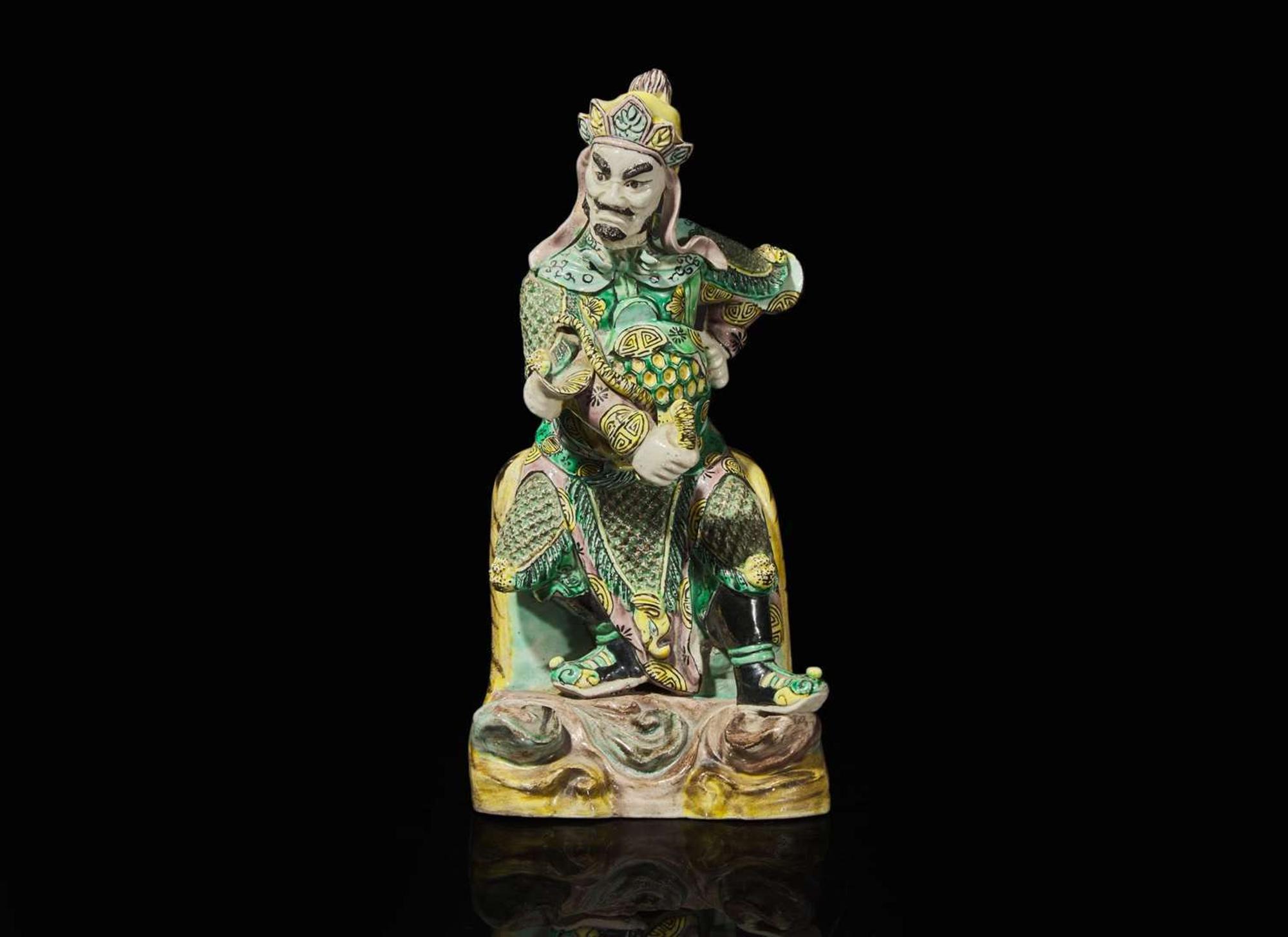 A Chinese famille verte figure of Guangmu Tianwang, guardian king of the West 素三彩造像一尊