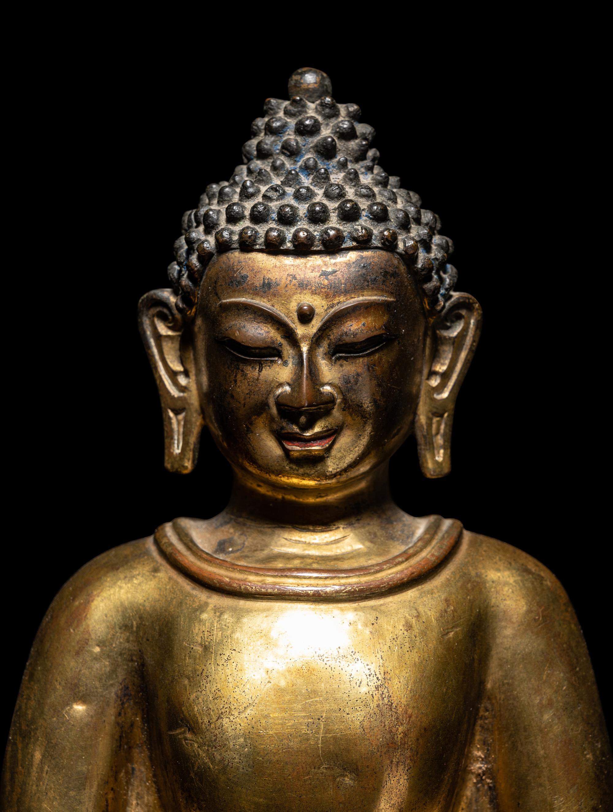 A Large Tibetan Gilt Bronze Figure of Seated Buddha