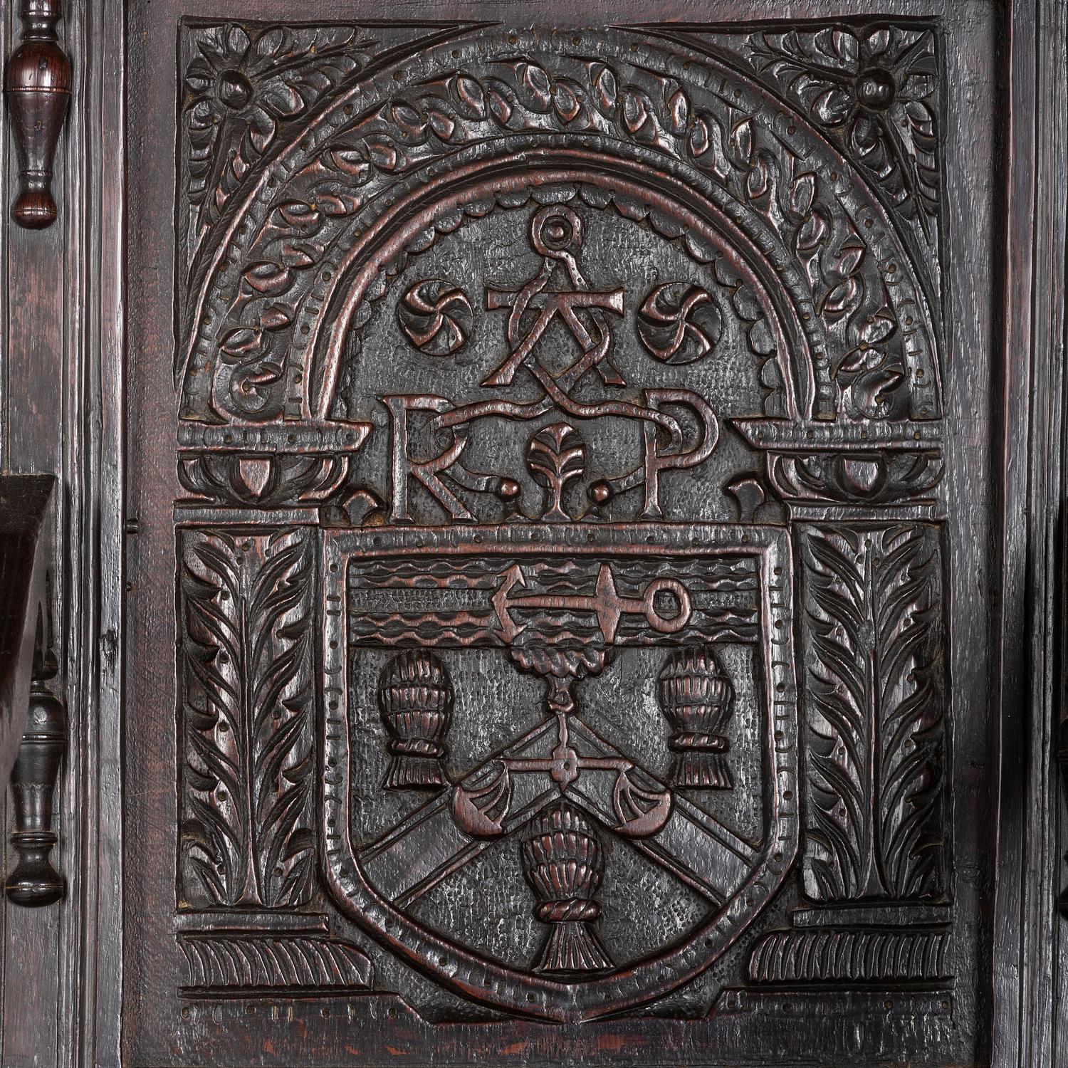 An English Carved Oak and Elm Panel-Back Armchair