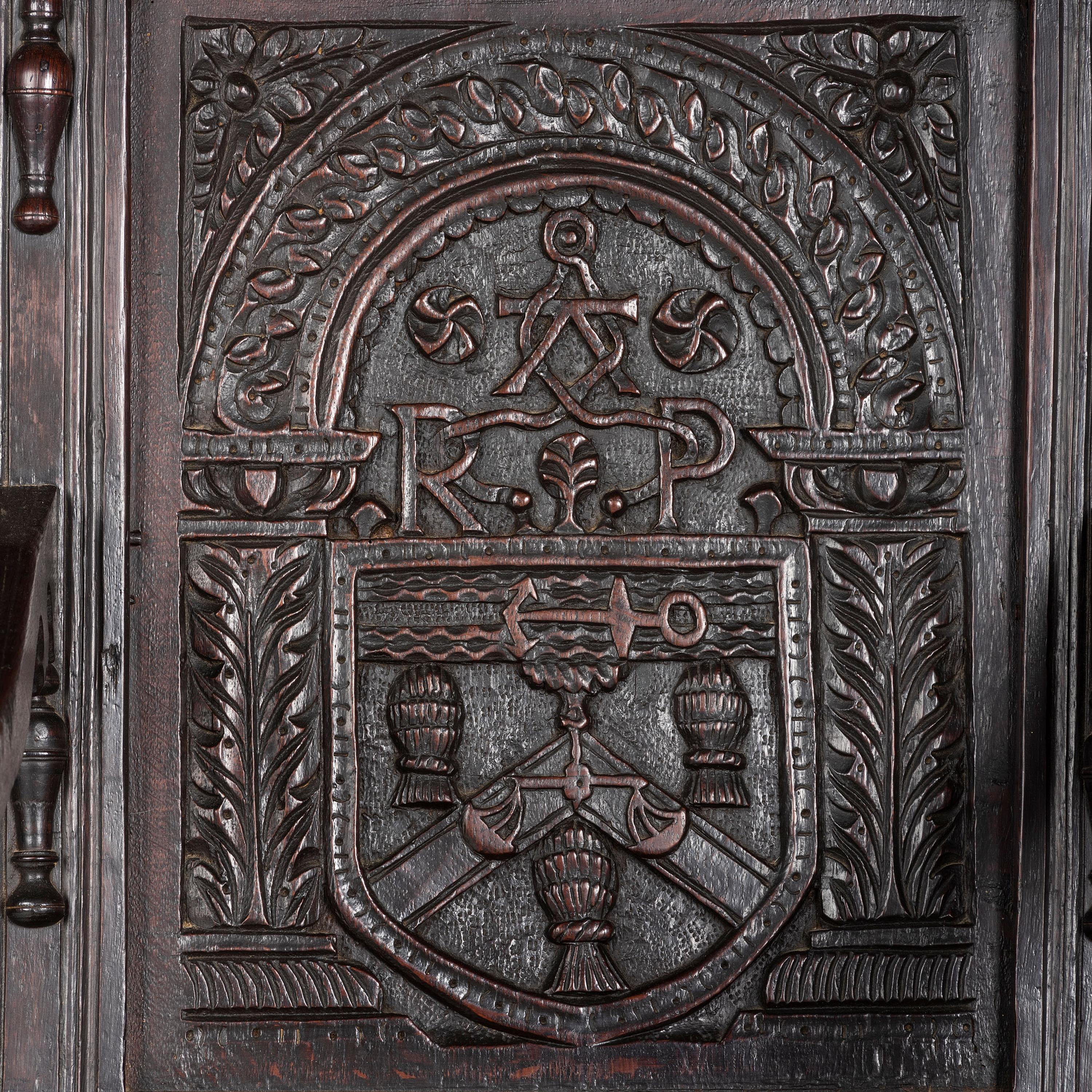 An English Carved Oak and Elm Panel-Back Armchair