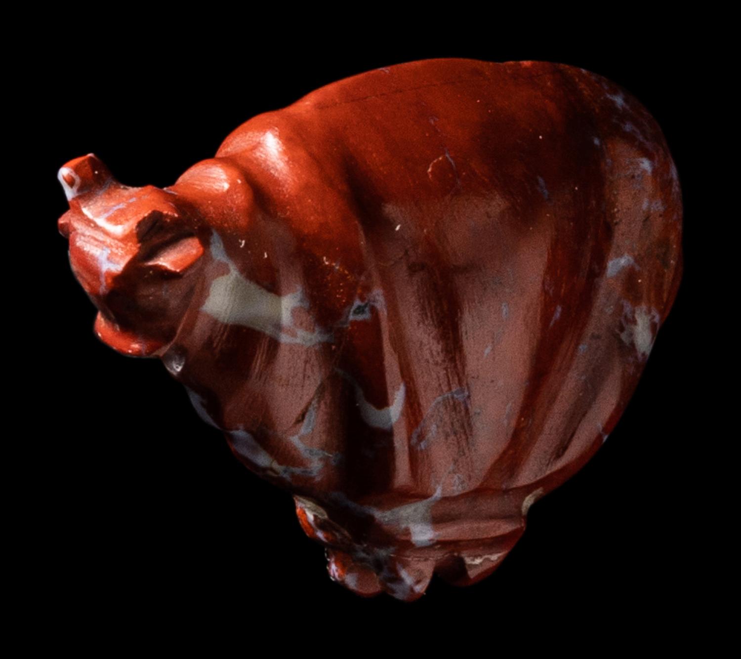 An Egyptian Red Jasper Trussed Ox