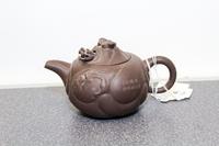 A Yixing Purple Stoneware Teapot and Cover Width 6 1/2 inches.