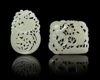 Two Celadon Jade Pendants. Length of largest 2 1/4 inches.