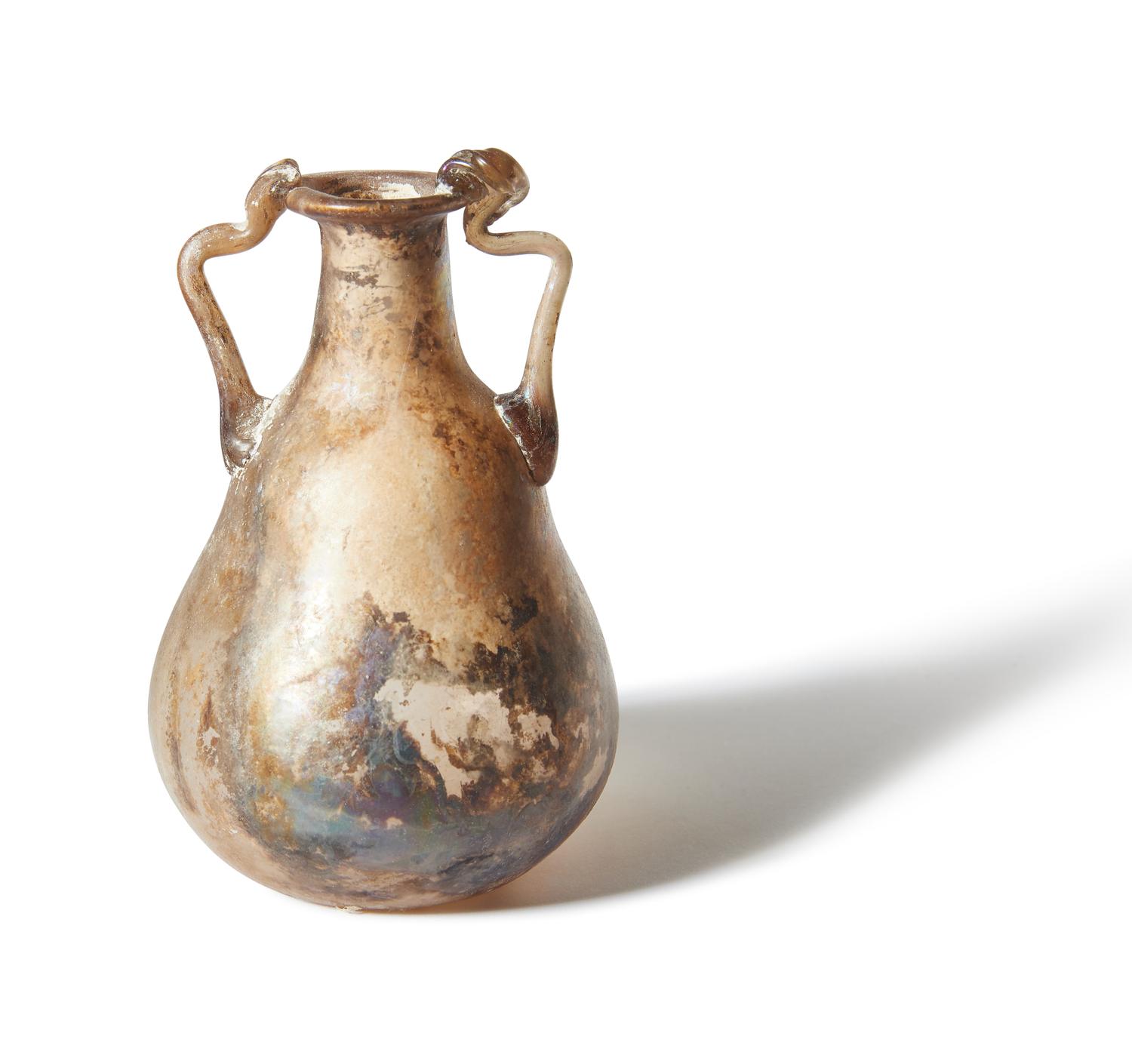 A Roman Pale Yellow Glass Bottle