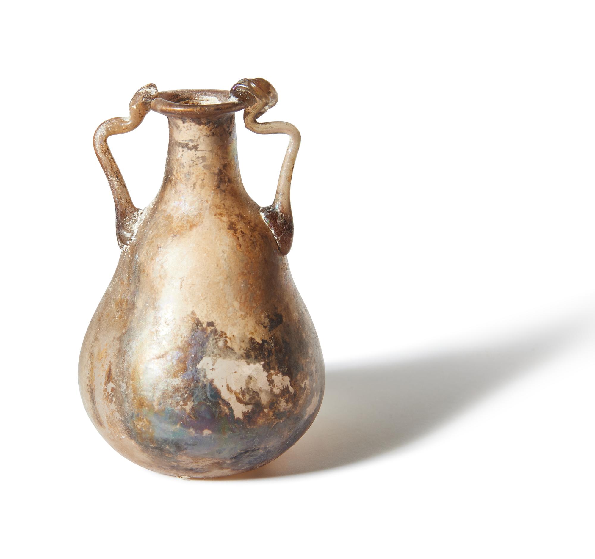 A Roman Pale Yellow Glass Bottle