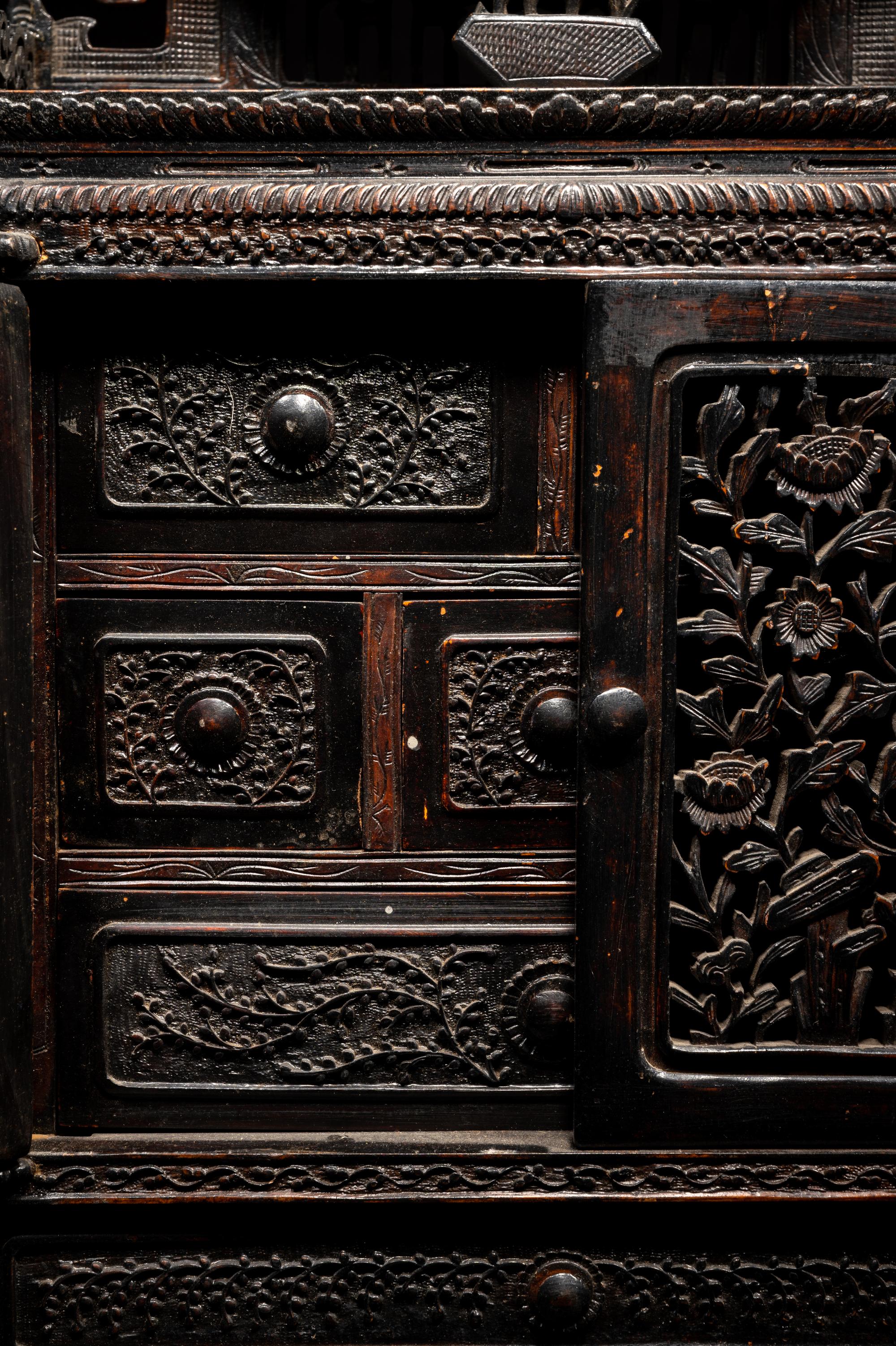 A Chinese Export Carved Hardwood Cabinet