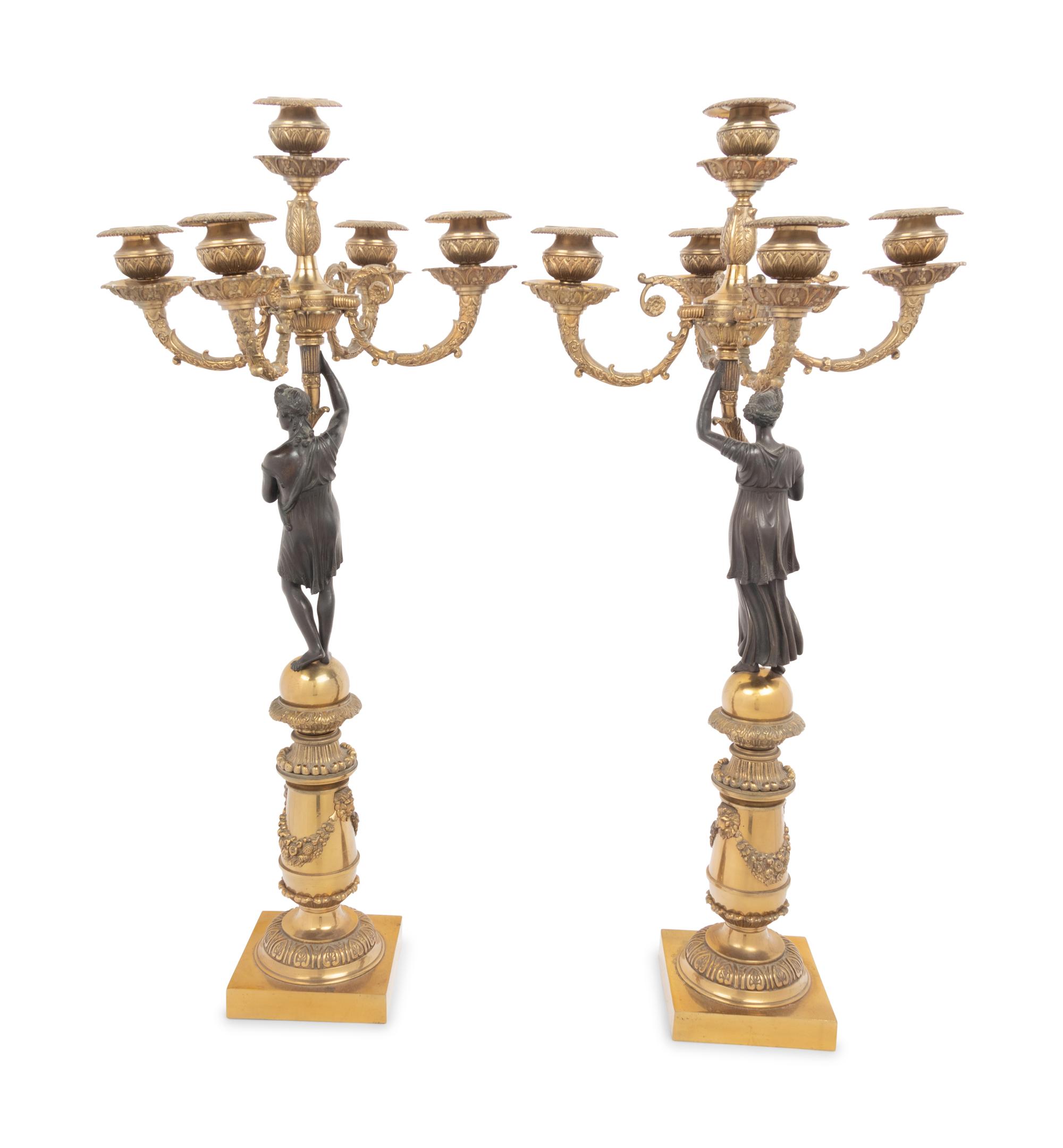 A Pair of Empire Style Gilt and Patinated Bronze Figural Five-Light Candelabra