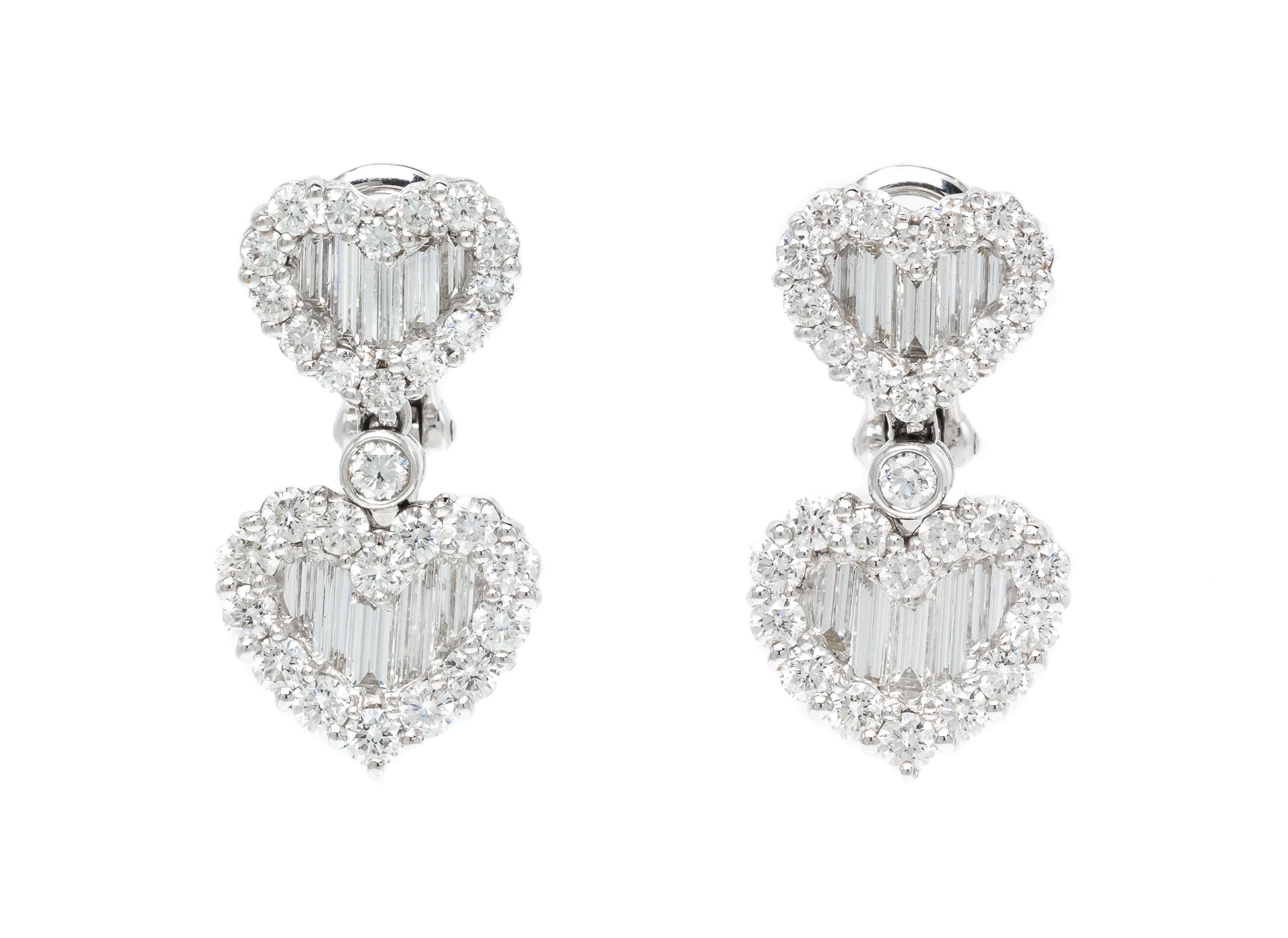 A Pair of 18 Karat White Gold and Diamond Heart Motif Earclips, 8.50 dwts.