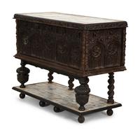 A Gothic Revival Carved Oak Tile-Mounted Chest on Stand