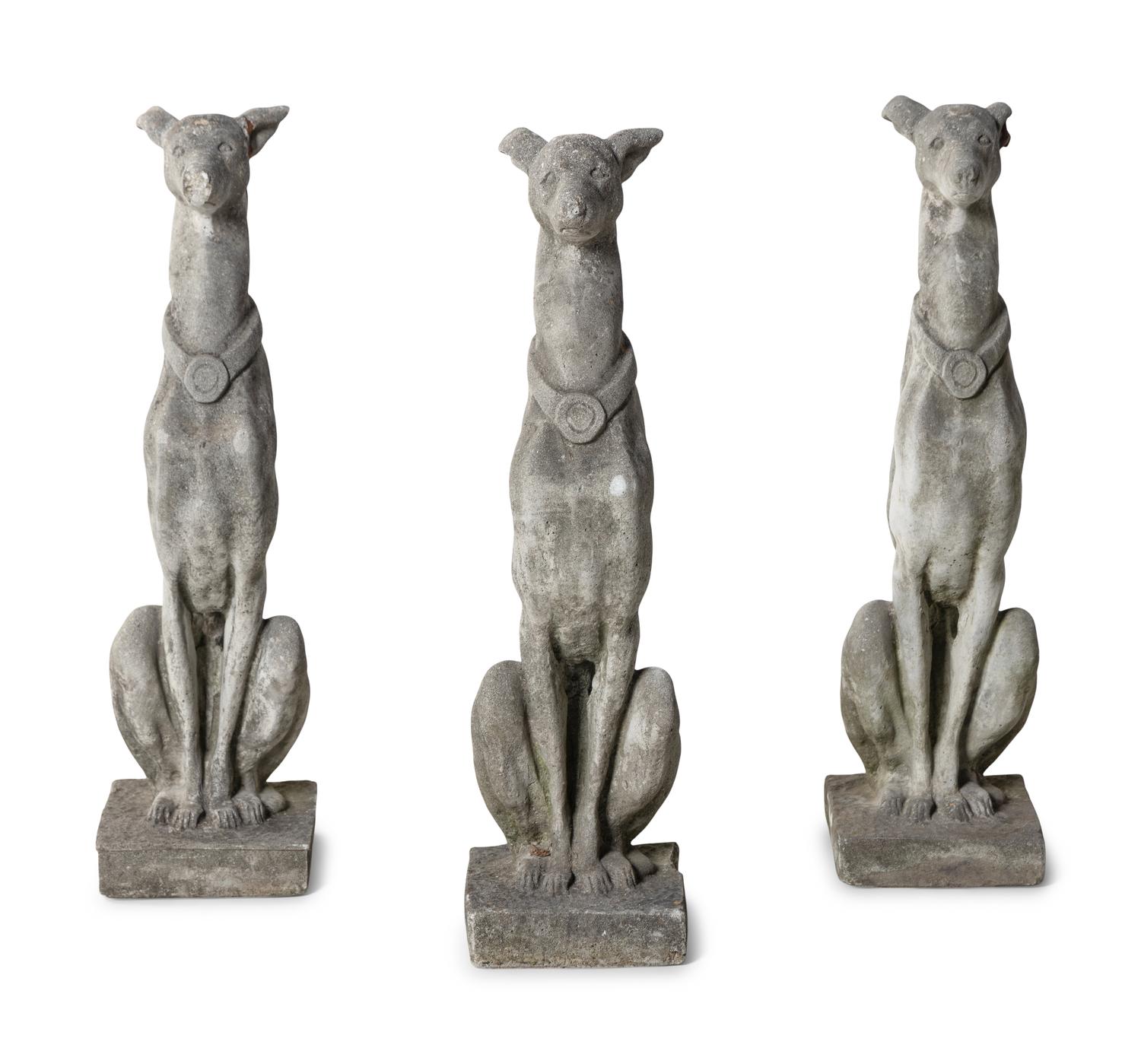 A Group of Cast Stone Hound Form Garden Statues