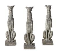 A Group of Cast Stone Hound Form Garden Statues