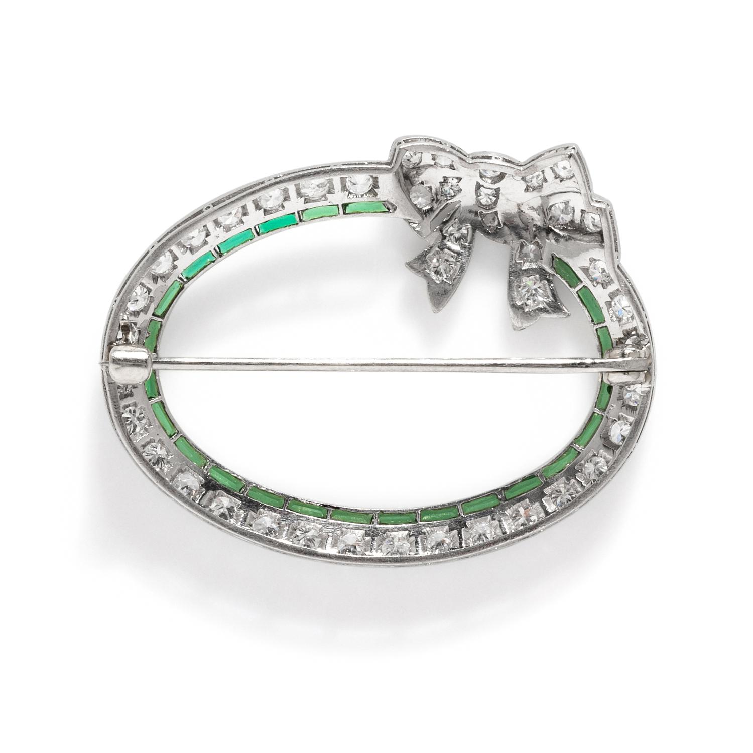 ART DECO, PLATINUM, DIAMOND, AND SYNTHETIC EMERALD BOW BROOCH