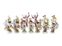 An Assembled Group of Nineteen Sitzendorf Porcelain Monkey Band Figures
