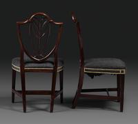 A Pair of Federal Carved Mahogany Shield-Back Dining Chairs