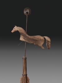 A Primitive Carved Pine and Cast Iron Horse Weathervane on Stand