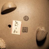 A Rare Yixing Peach-Form 'Figure' Puzzle Cup with Impressed Seals 'Chen', 'Mingyuan' and Wood Stand 陳鳴遠款醉翁桃形公道杯