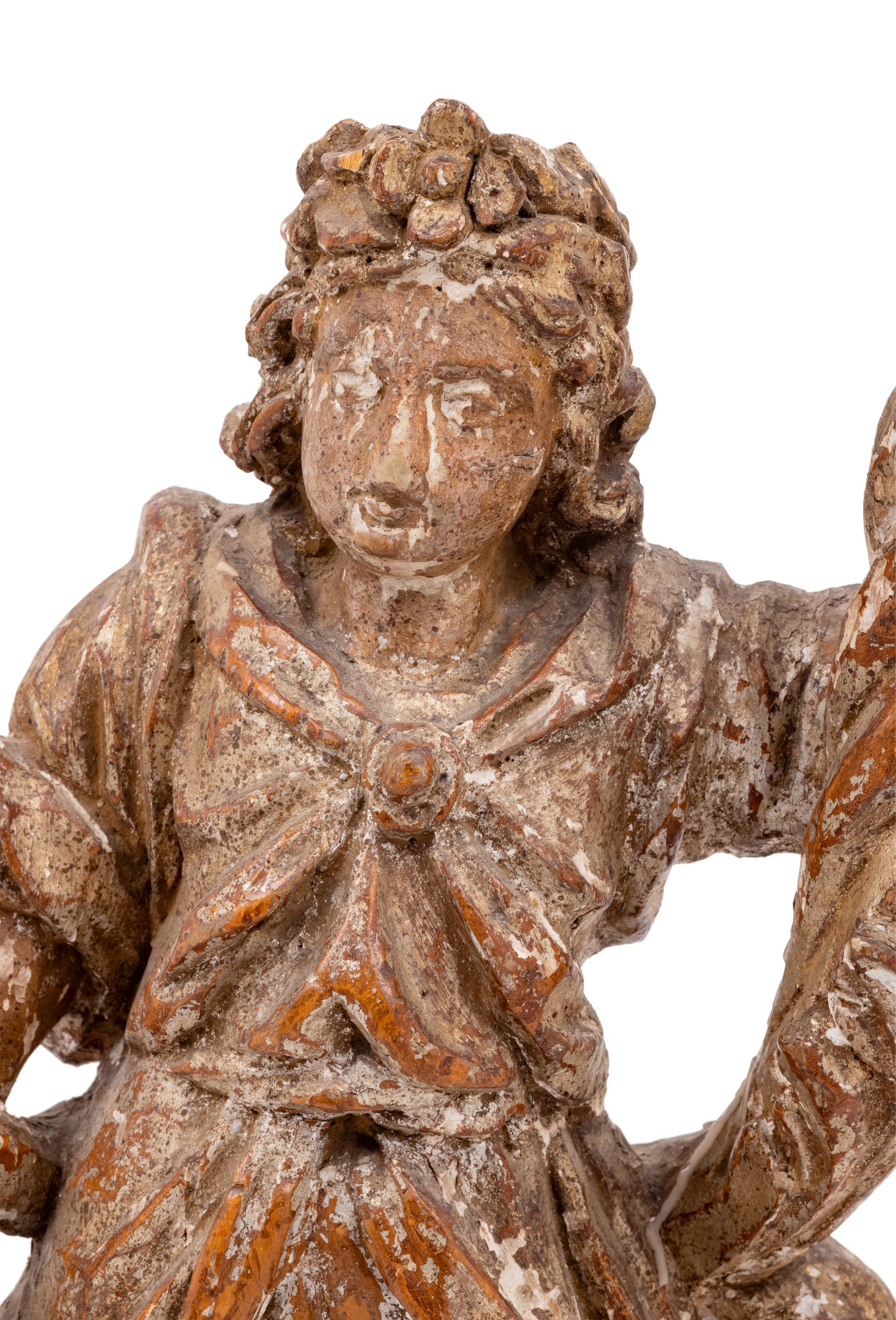 A Continental Carved Santo Figure with Remnants of Polychrome