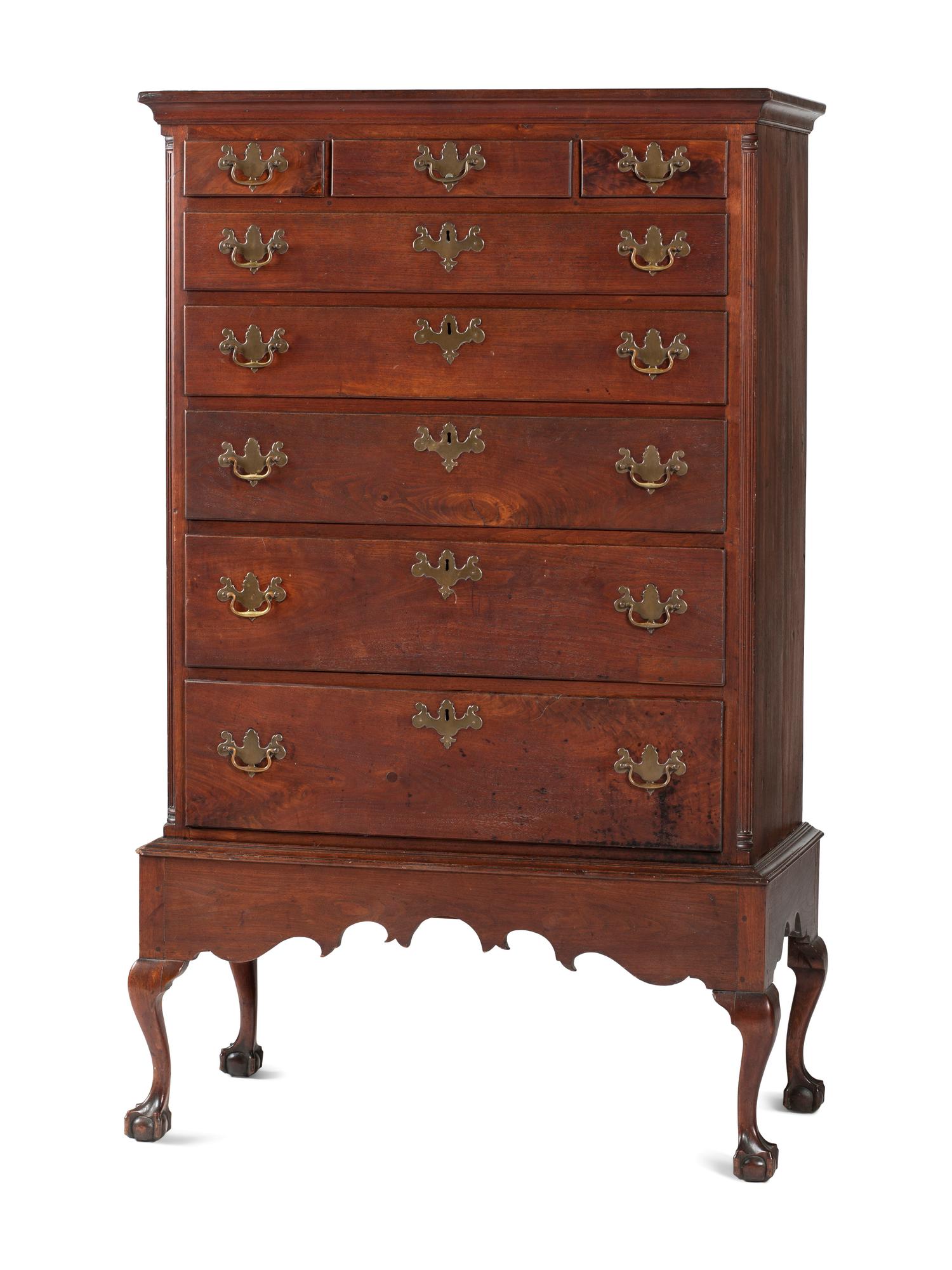 A Chippendale Carved and Figured Walnut Chest on Claw-and-Ball Foot Stand