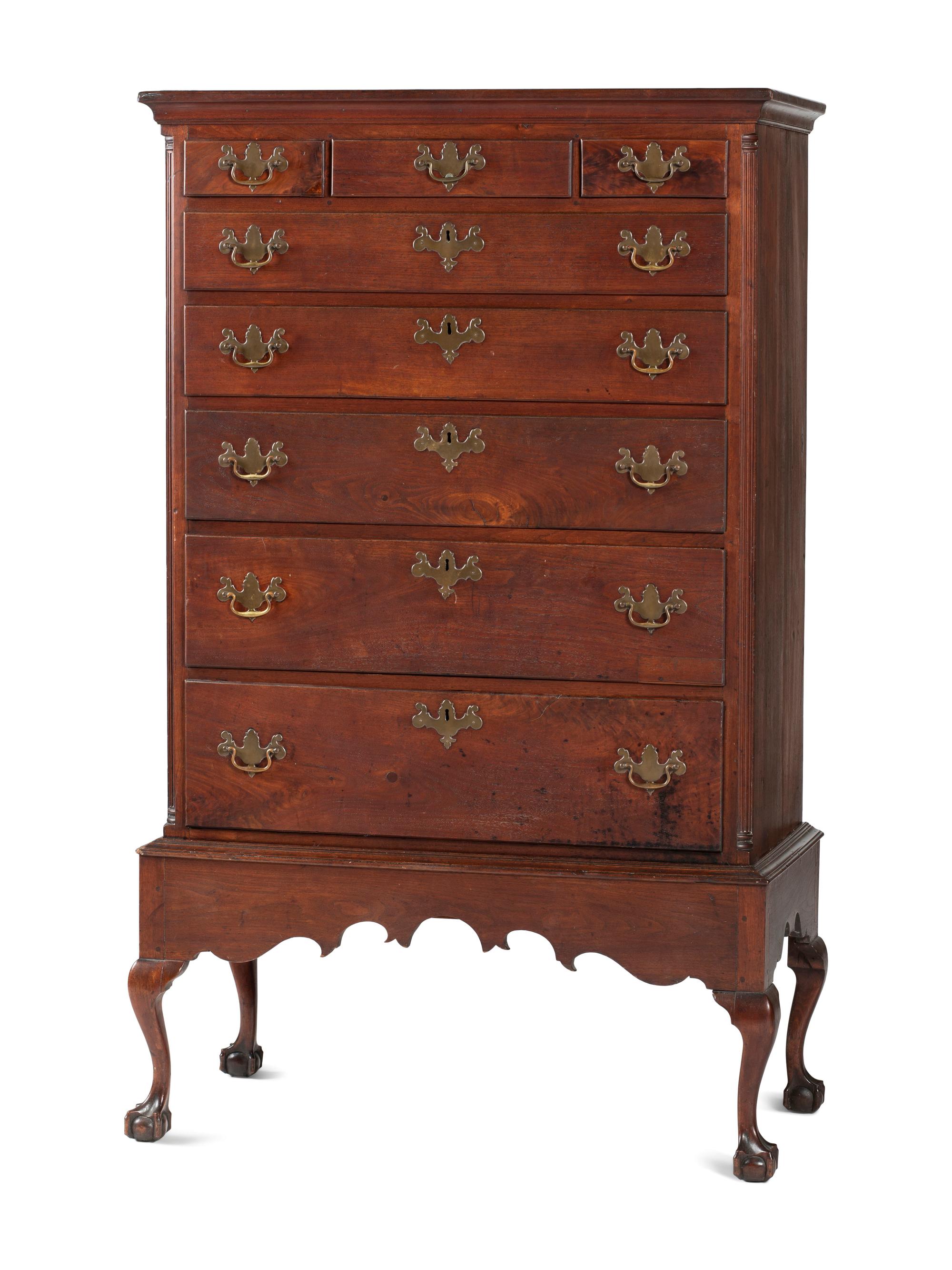 A Chippendale Carved and Figured Walnut Chest on Claw-and-Ball Foot Stand