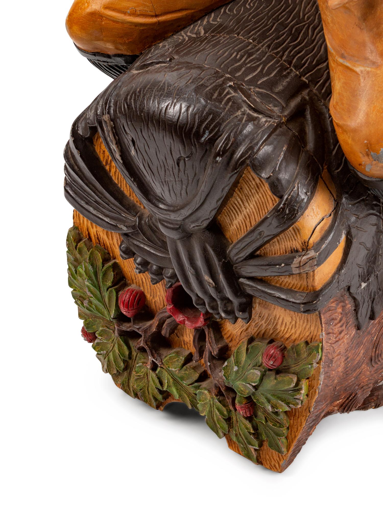 A Dutch Carved and Polychromed Figure of a Man Astride a Wine Barrel