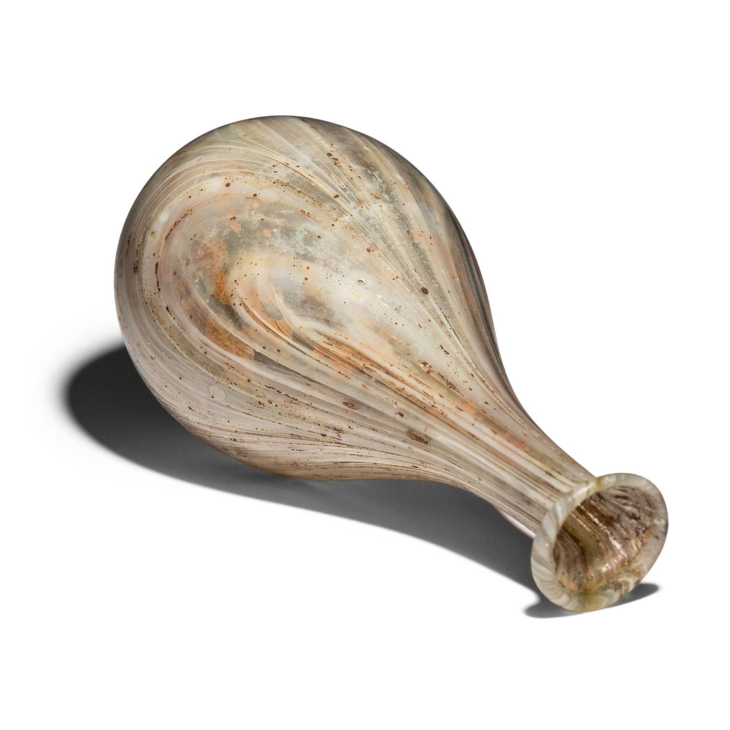 A Roman Marbled Pale Green and White Glass Bottle