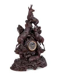 A Black Forest Carved Mantel Clock